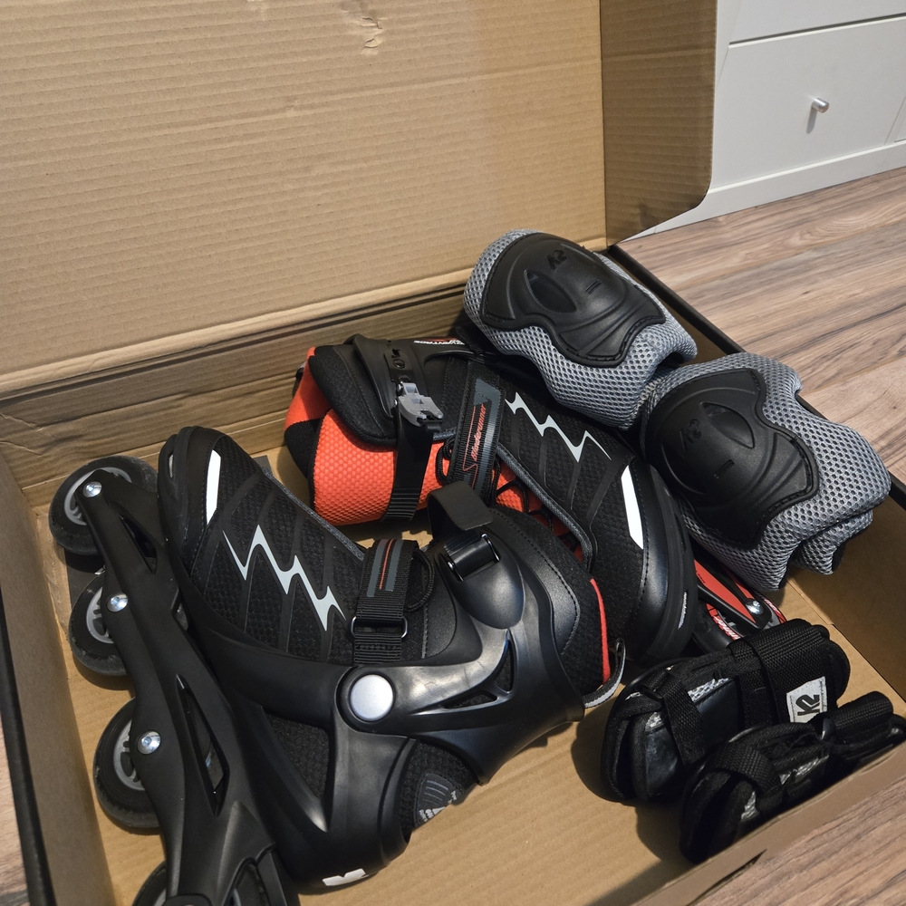 Black and Red Rollerblades with Protective Gear
